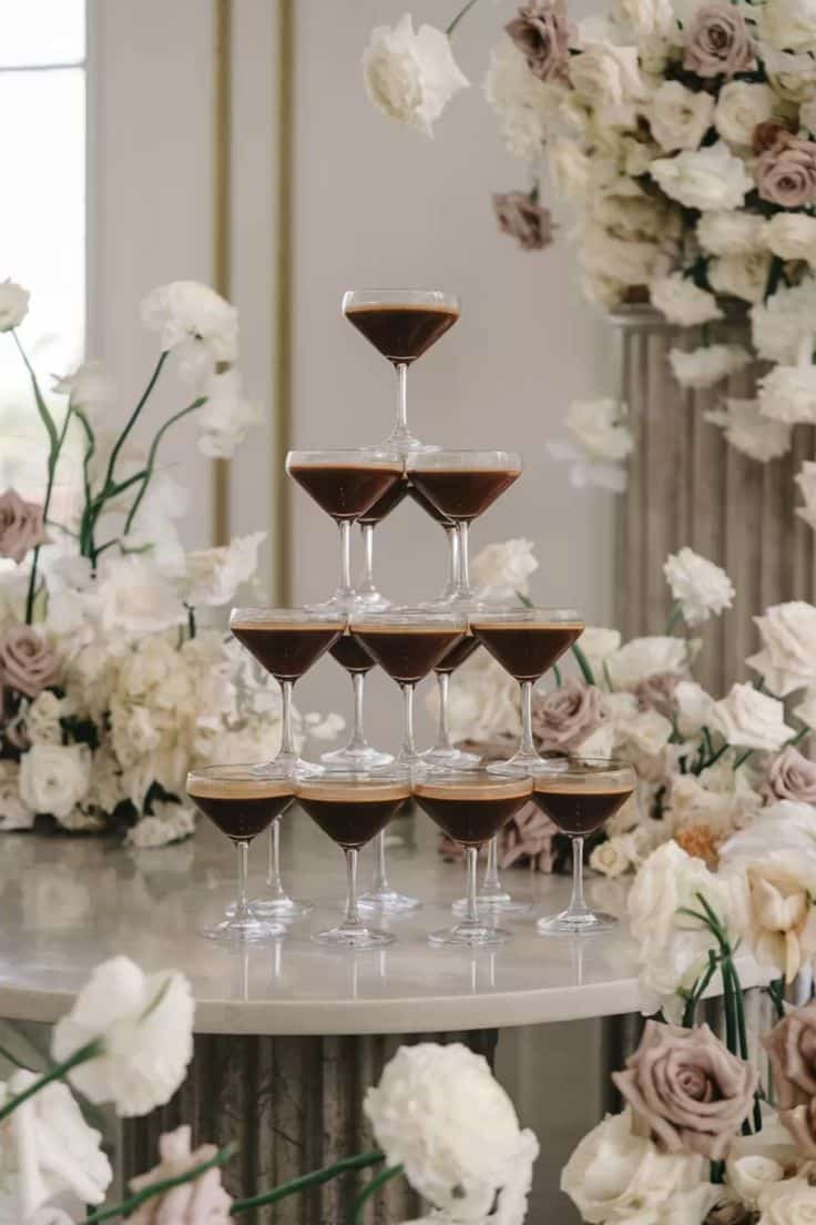 Espresso martini tower at Factory 51 engagement party in Brisbane, styled with fresh flowers for a cocktail celebration.