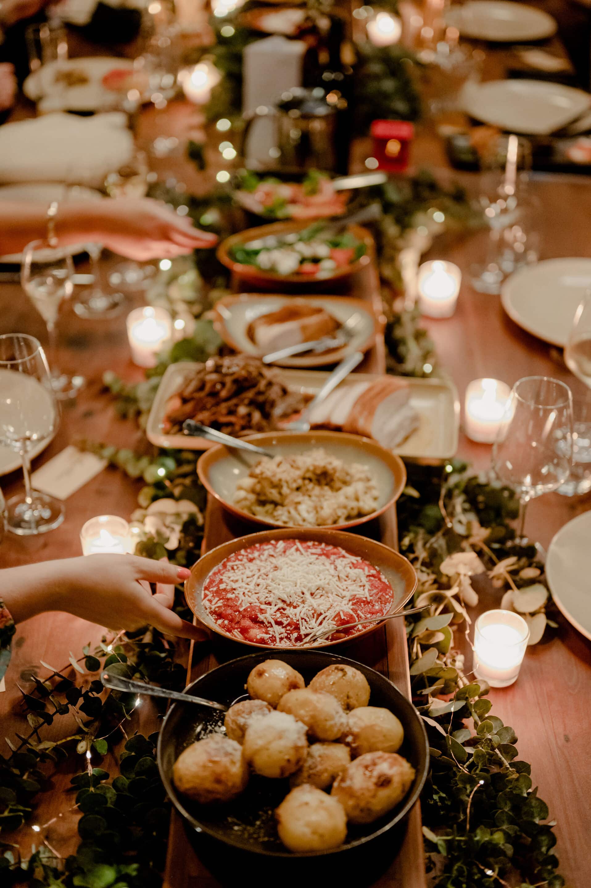 Shared feast table at a corporate Christmas party Brisbane with guests dining together corporate christmas party ideas brisbane, corporate christmas party brisbane, christmas party venue brisbane, work christmas party ideas brisbane, unique christmas party brisbane, fun christmas party ideas brisbane, corporate events brisbane, christmas function venue brisbane