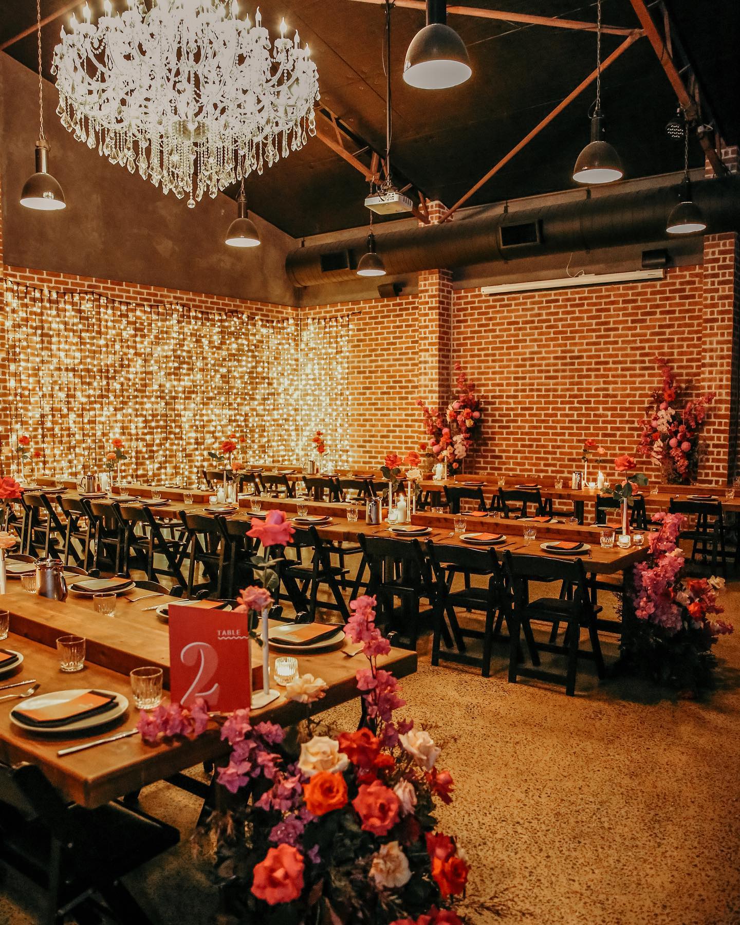 affordable wedding venue Brisbane reception Factory 51 chandelier industrial space
