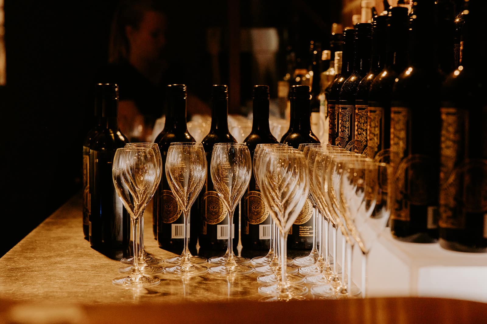 Wine glasses and bottles prepared for a cocktail wedding reception at Factory51