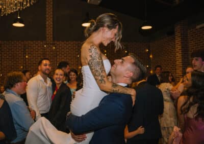 Indi and Jeremy celebrating on the dance floor at their Factory51 wedding reception