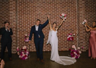 Indi and Jeremy celebrating after their wedding ceremony at Factory51 Coorparoo