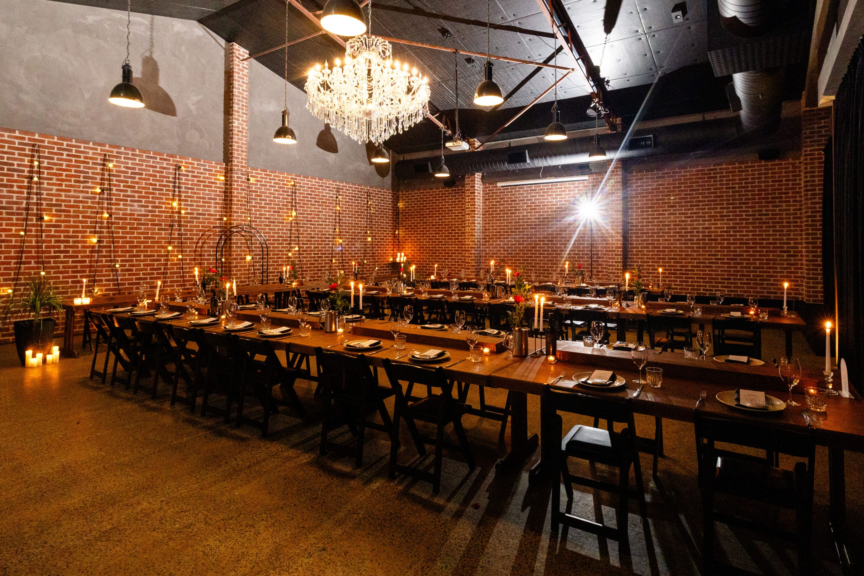 A stunning wedding reception set up in an industrial chic unique wedding venue