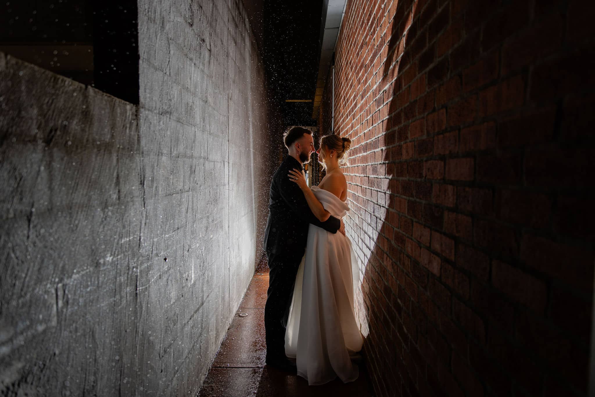 A newlywed couple in a private laneway at a unique wedding venue